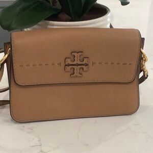 New, without tags. crossbody or shoulder. Two interior sections,